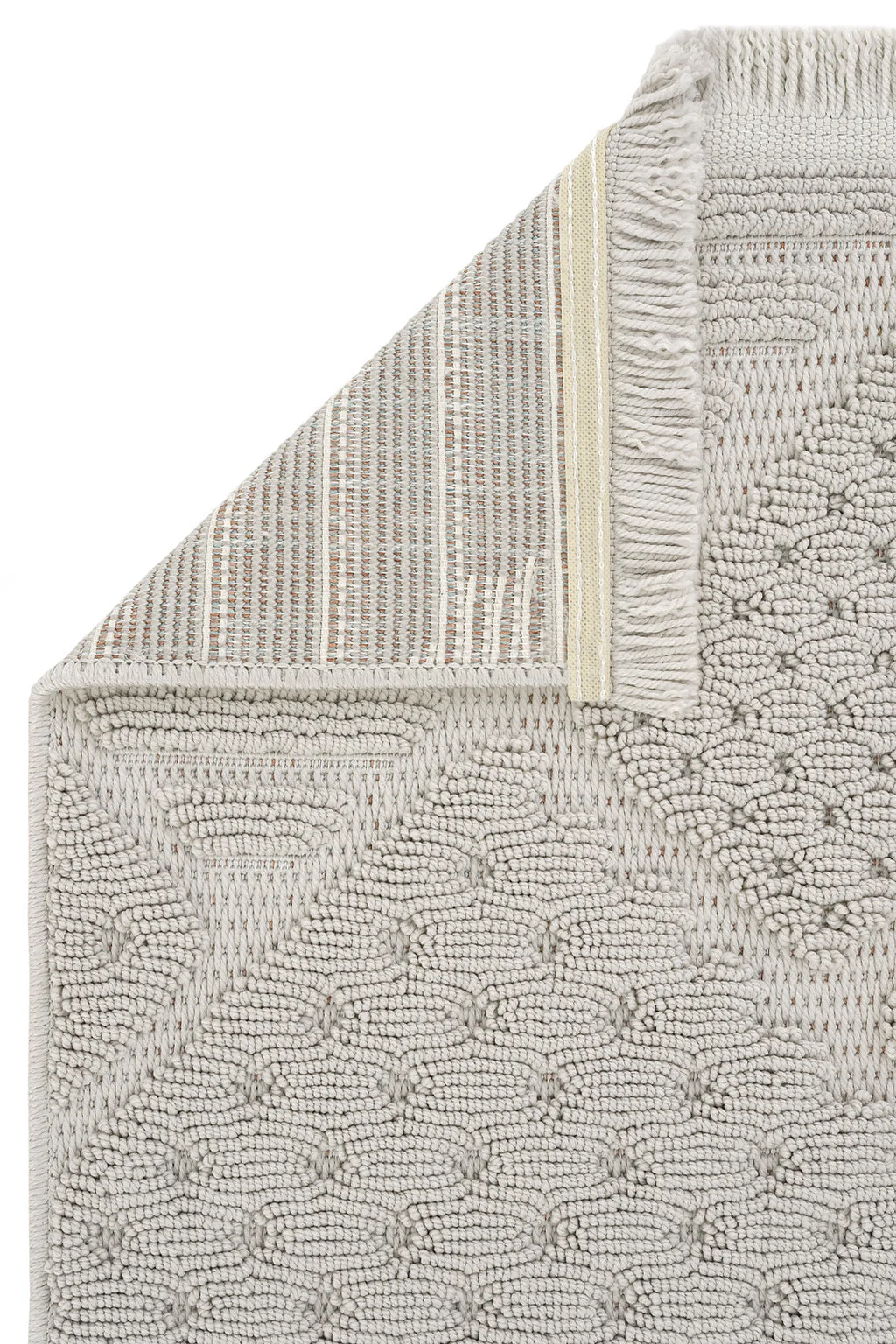 Krem rengi dokuma detaylı yuvarlak desenli banyo paspası, kenarında püsküller