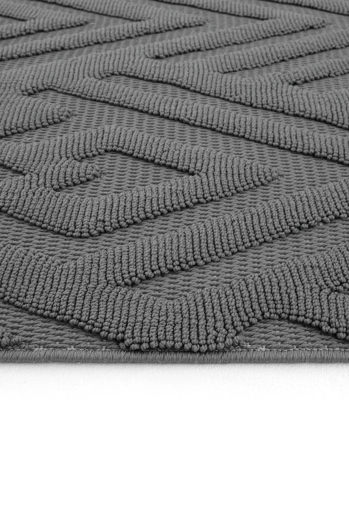 Gri renkli dokulu geometrik desenli modern dekoratif halı detay görünümü