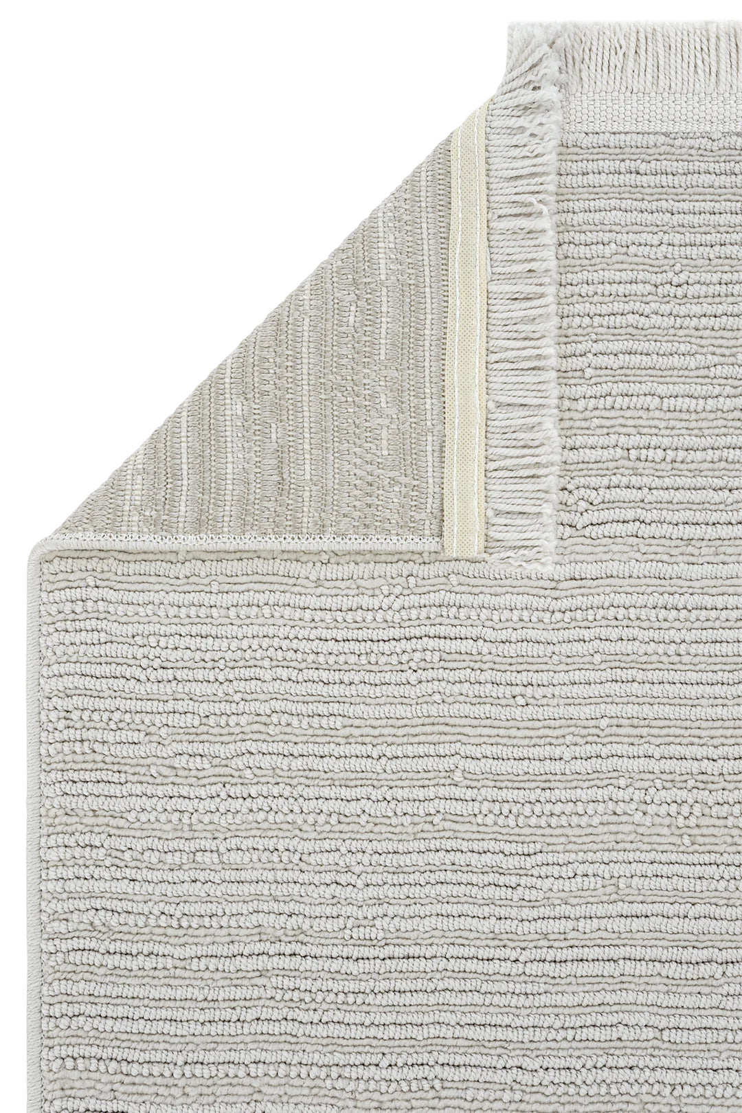 Açık gri renkli, dokulu ve püsküllü modern kütleli pamuk paspas köşe detaylı