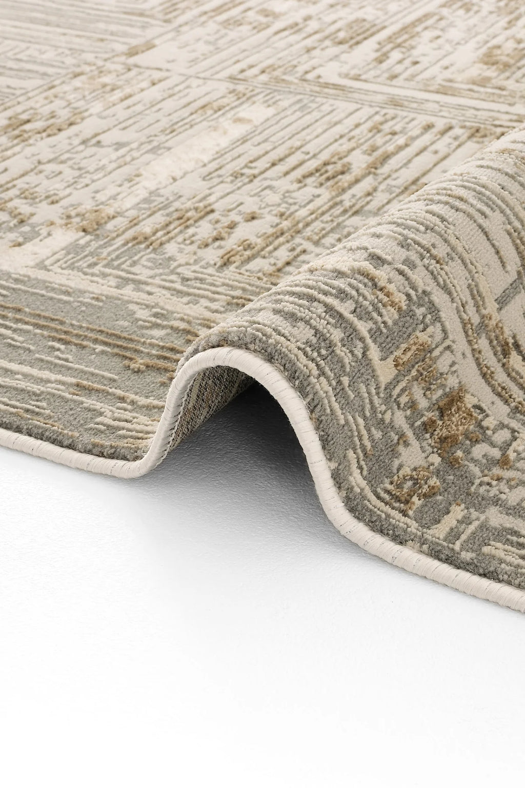 Vizon ve gri tonlarda modern desenli Luxess Hermes halı, kıvrılarak serili