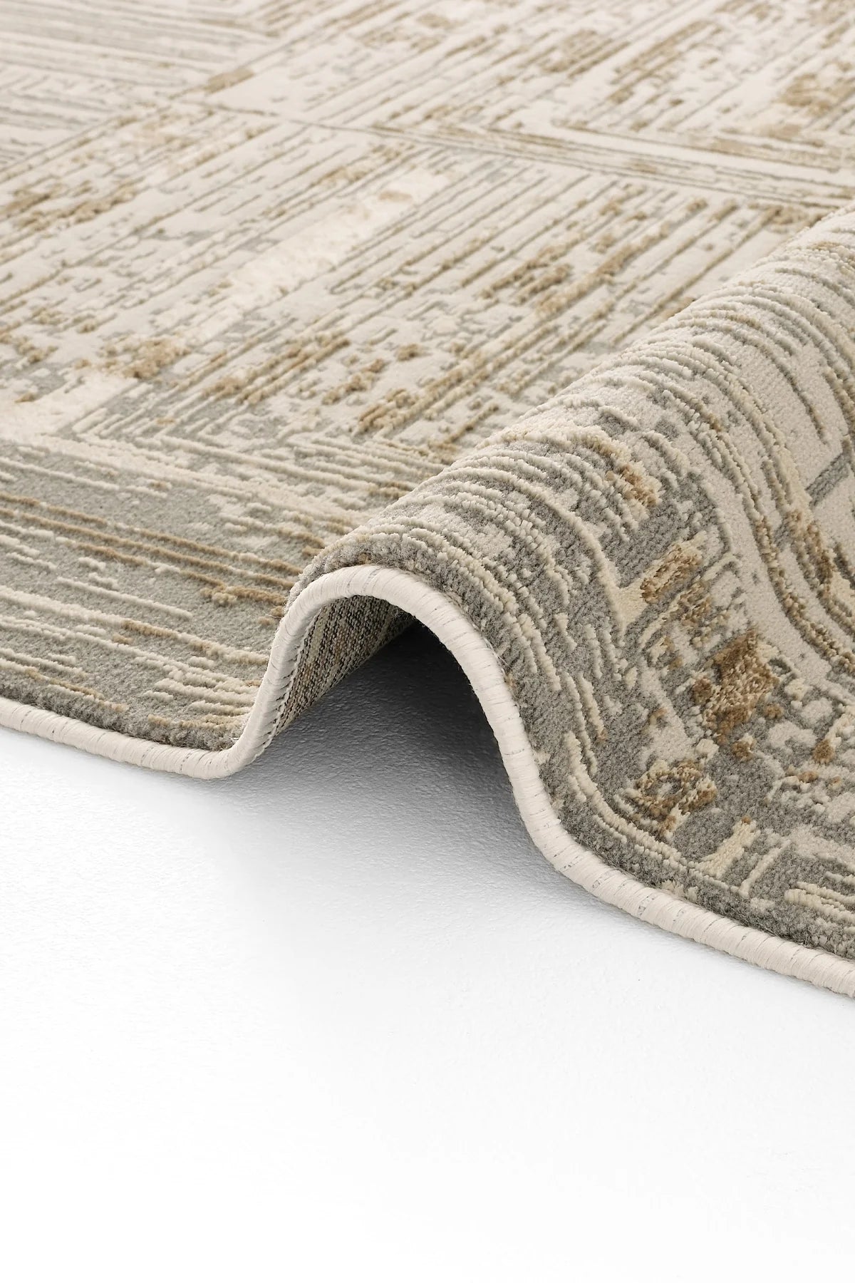 Vizon ve gri tonlarda modern desenli Luxess Hermes halı, kıvrılarak serili