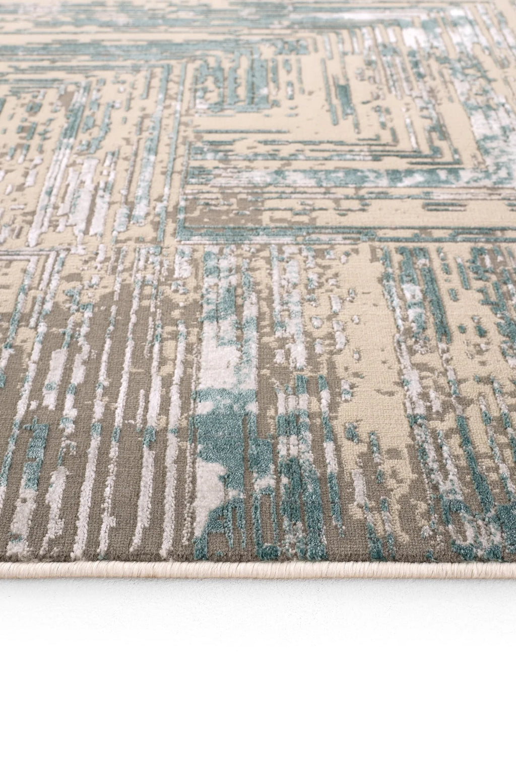 Mavi, bej ve gri tonlarında soyut desenli Luxess Hermes 1005 halı kenarı detayı